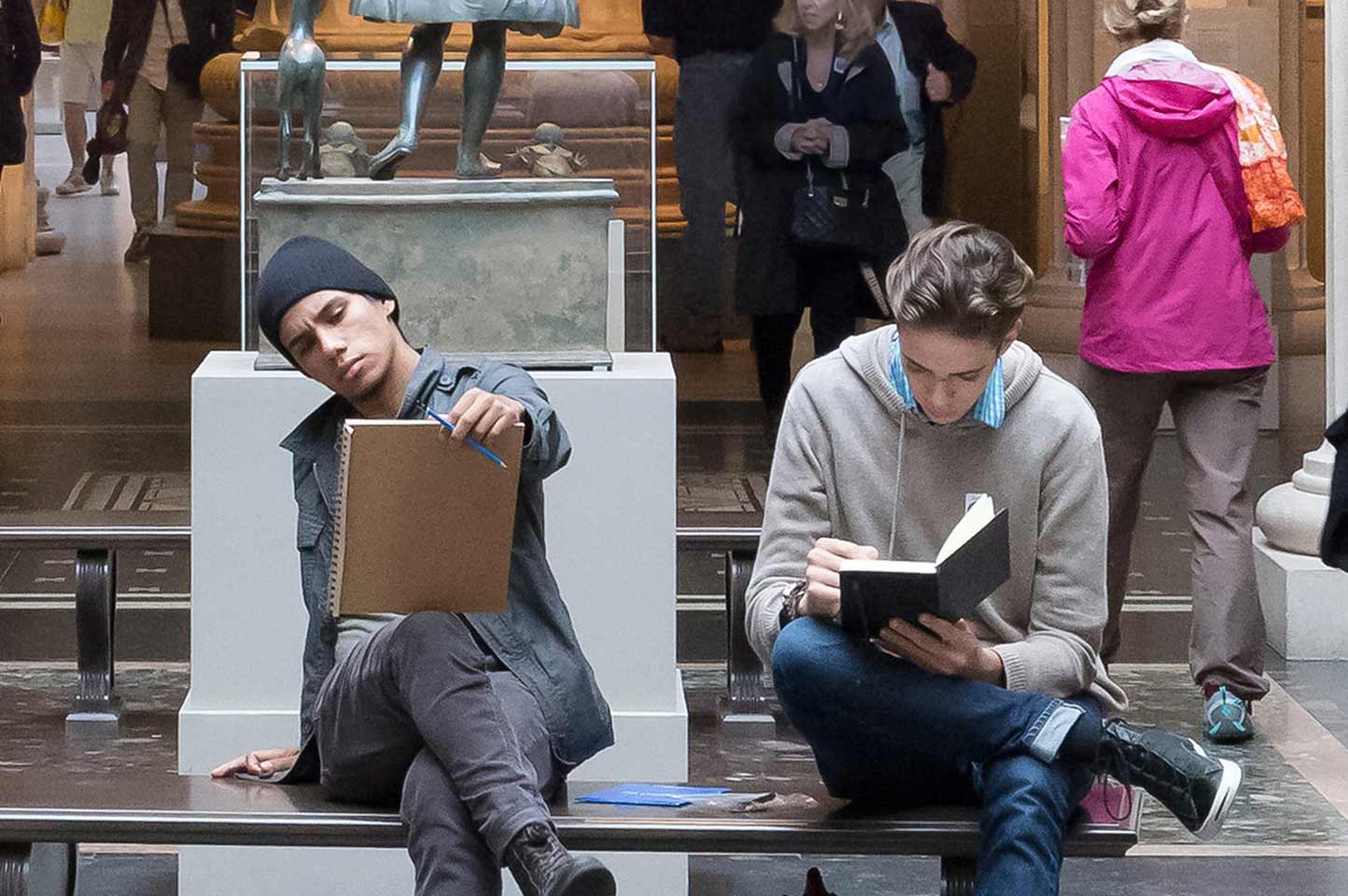 Two young men sketching in the galleries